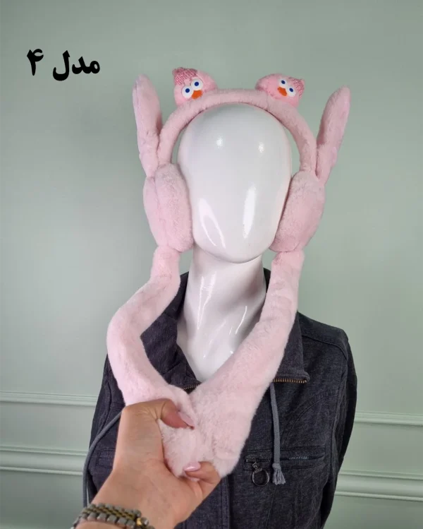 گوش‌گیر بچه‌گانه پمپی طرح عروسک کلاه‌دار